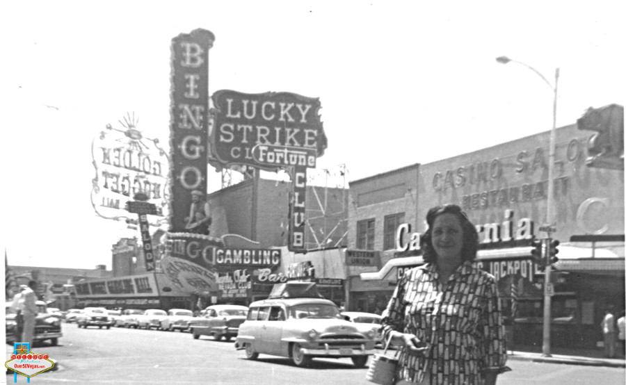 This personal photograph shows the California Club behind this happy tourist's head! Above her to the upper right is the bear mascot.