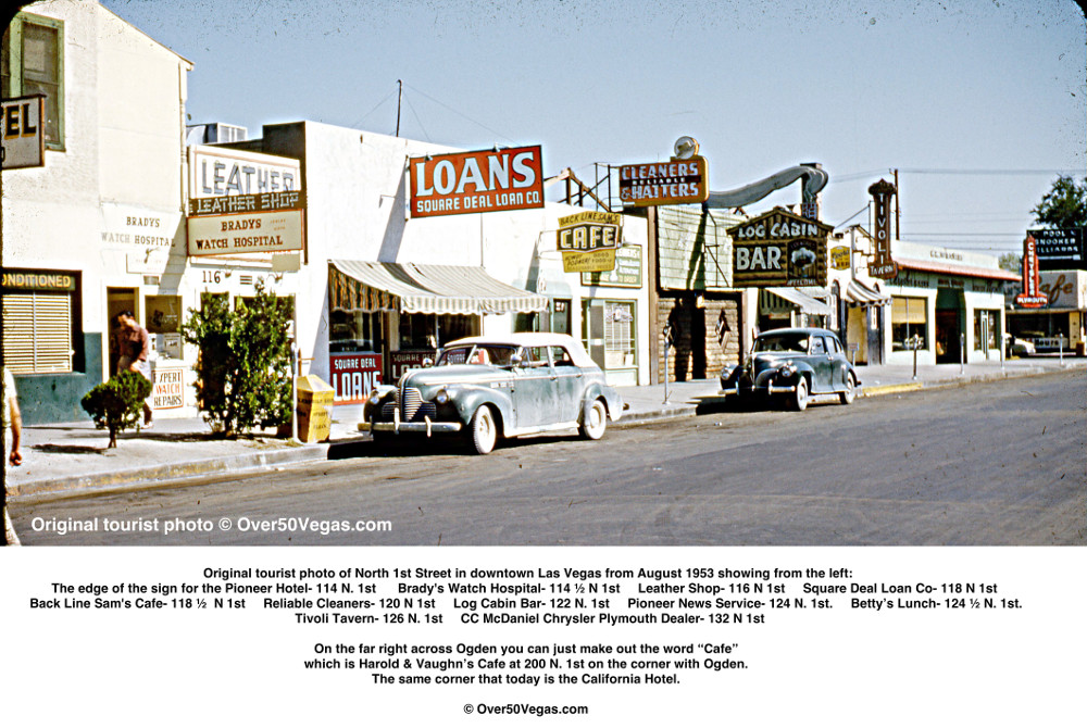 The edge of the sign for the Pioneer Hotel- 114 N. 1st     	Brady's Watch Hospital- 114 ½ N 1st 
Leather Shop- 116 N 1st    Square Deal Loan Co- 118 N 1st  Back Line Sam's Cafe- 118 ½  N 1st 
Reliable Cleaners- 120 N 1st    Log Cabin Bar- 122 N. 1st   Tivoli Tavern- 126 N. 1st. and all the way on the right is the  CC McDaniel Chrysler Plymouth Dealer- 132 N 1st  